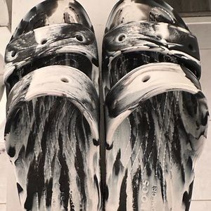 Crocs sandals black and white marble.Warn a couple of times. M size 6 W size 8.